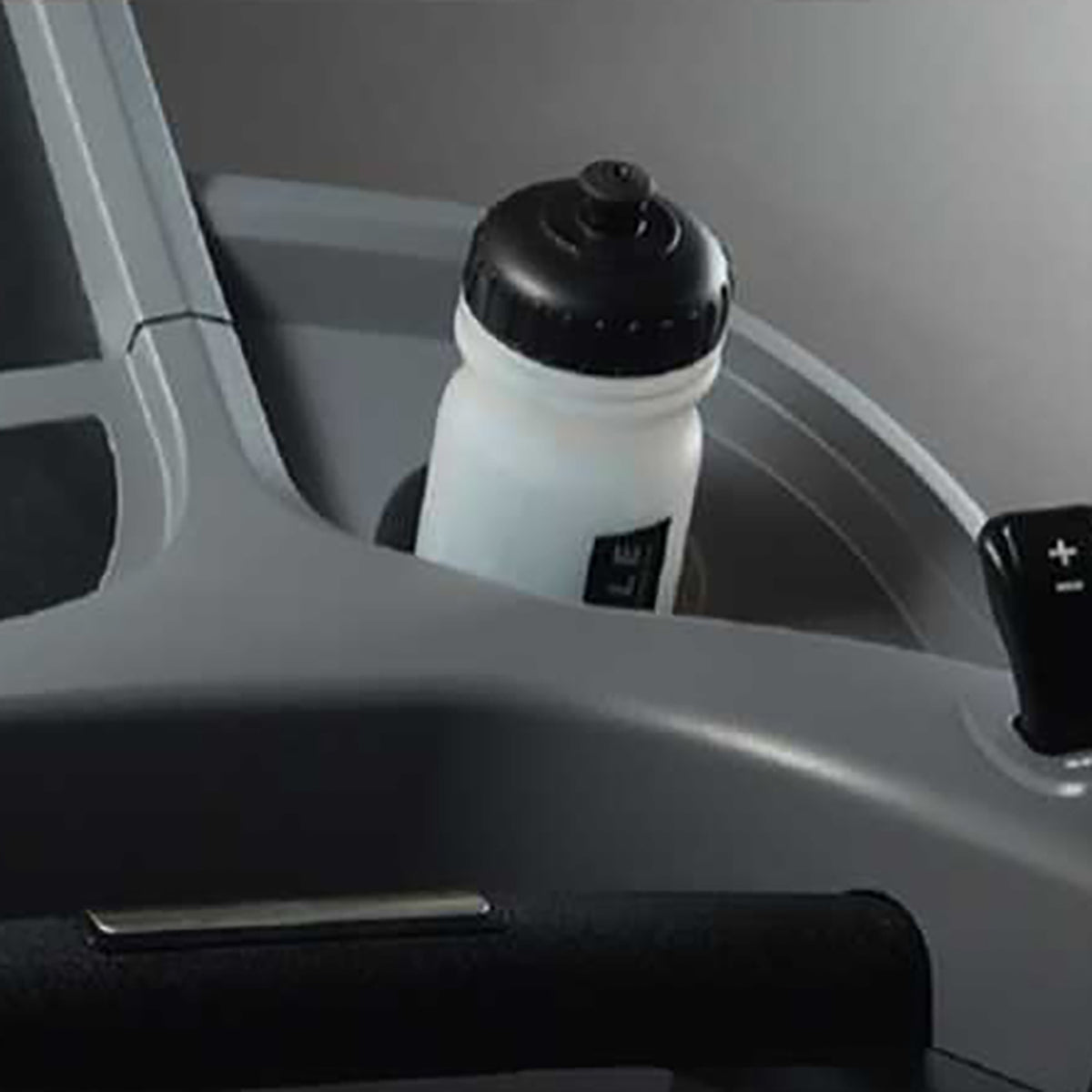 Gym Gear T98 Treadmill GG-T-002 in black. Close up of the water bottle holder with water bottle in use