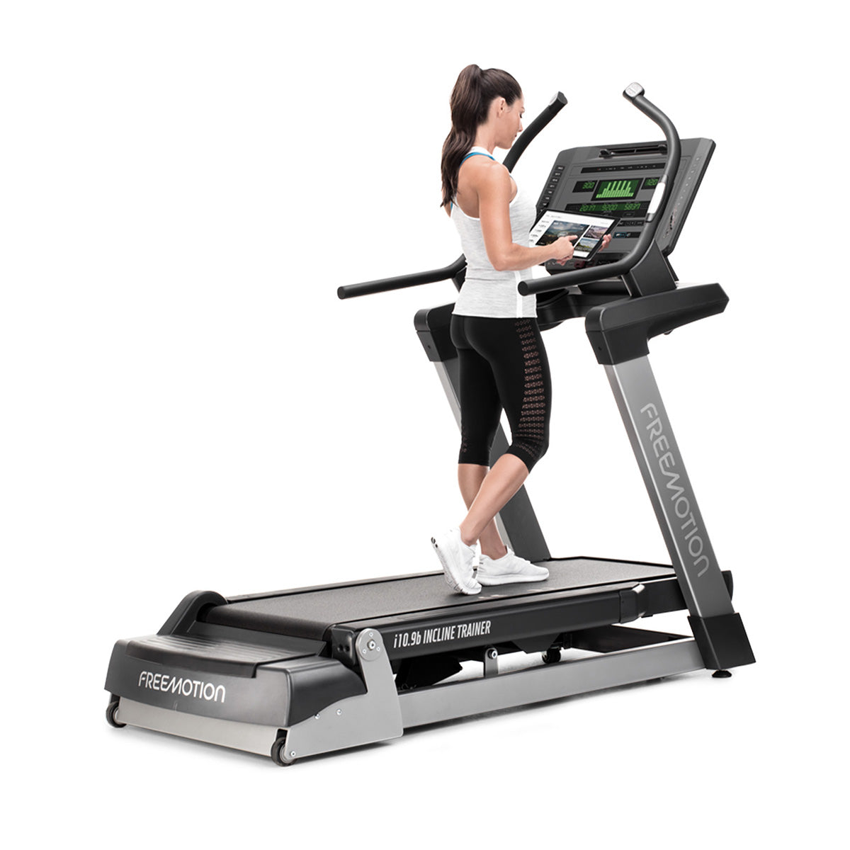 Freemotion i10.9b Incline Trainer showing person walking in decline from an angle